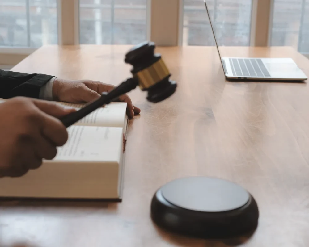 compressed_close-up-judge-holding-gavel-table