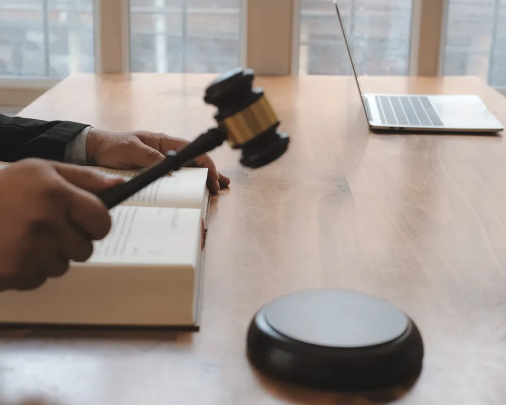 compressed_close-up-judge-holding-gavel-table