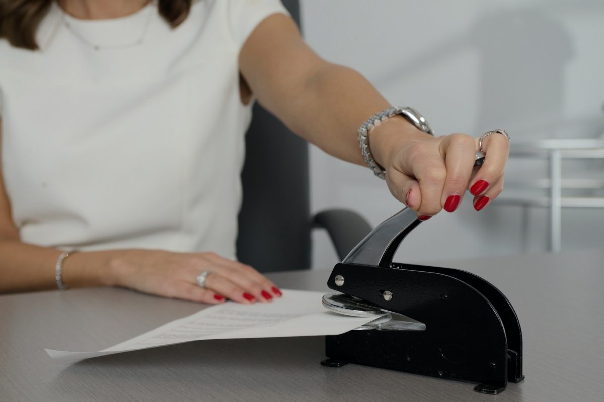 Notary stamping a document
